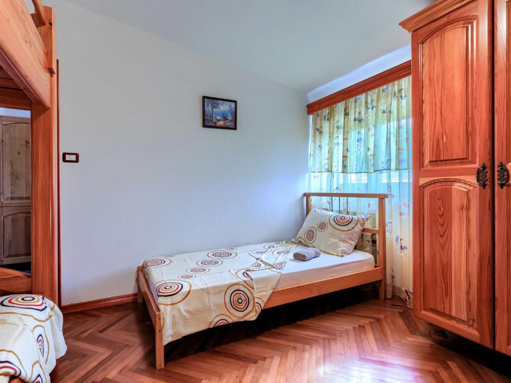Postel nebo postele na pokoji v ubytování Holiday Home Edi by Interhome