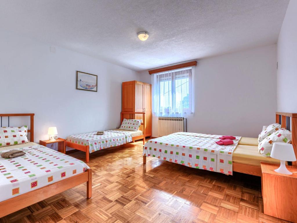 Postel nebo postele na pokoji v ubytování Holiday Home Edi by Interhome