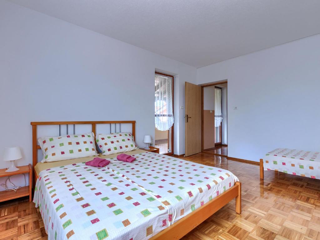 Postel nebo postele na pokoji v ubytování Holiday Home Edi by Interhome