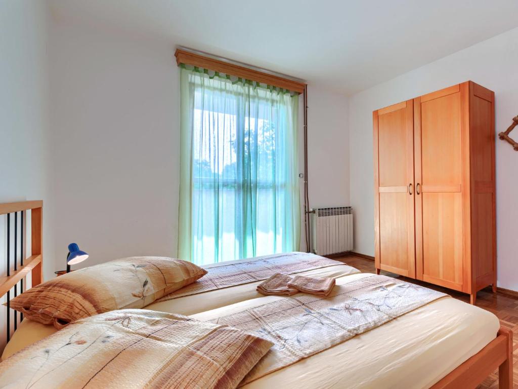 Postel nebo postele na pokoji v ubytování Holiday Home Edi by Interhome