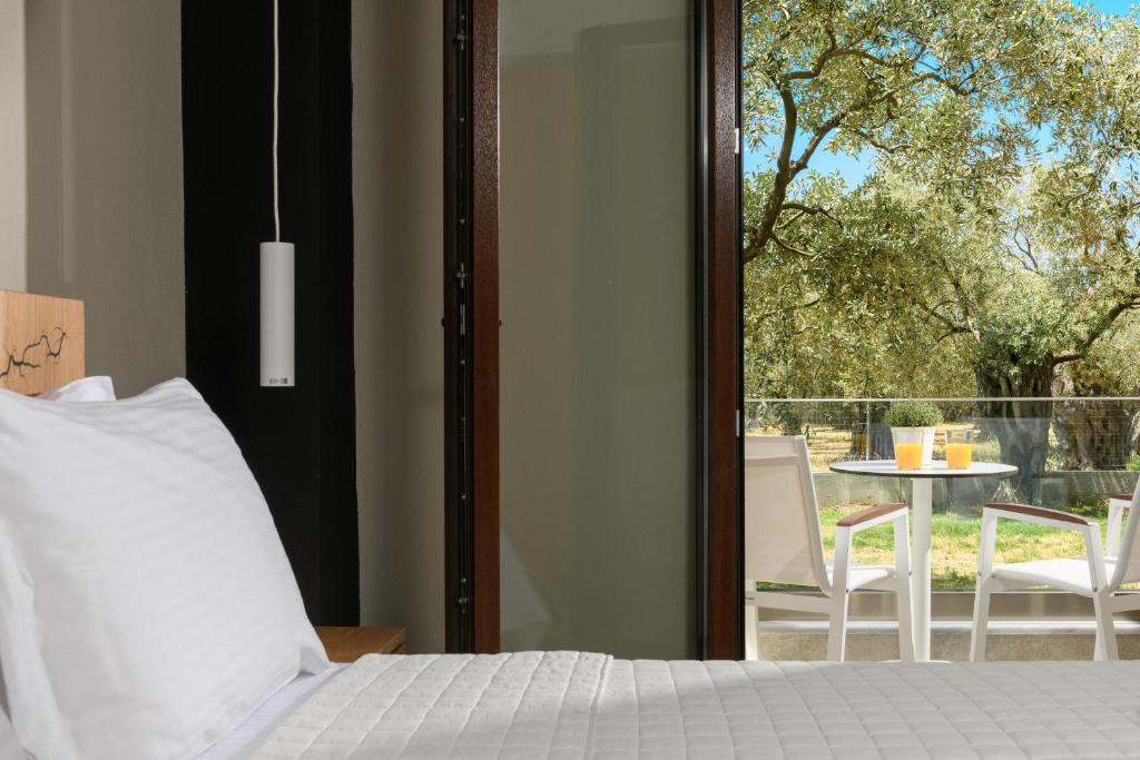 Postel nebo postele na pokoji v ubytování Olea Luxury Villa