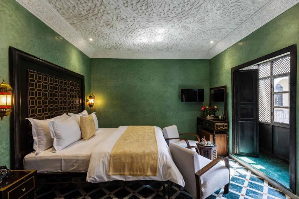 Postel nebo postele na pokoji v ubytování Alrashid Marrakech