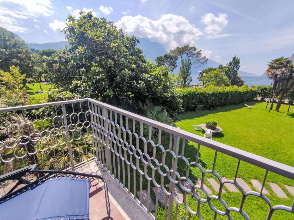 a bird standing on the balcony of a house at Apartment Garda Sapphire by Interhome in Riva del Garda