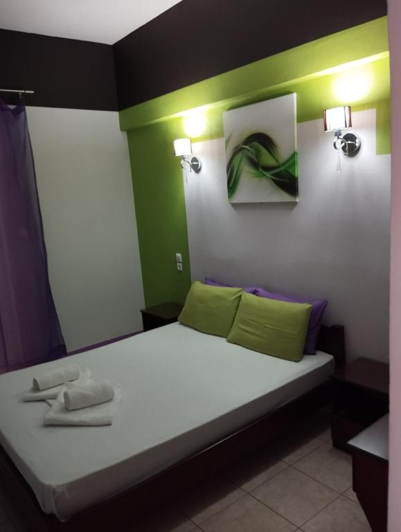 Postel nebo postele na pokoji v ubytování Hotel Neon Astron
