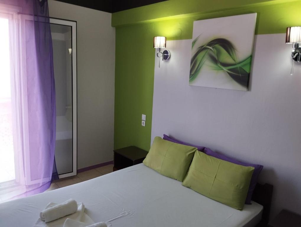 Postel nebo postele na pokoji v ubytování Hotel Neon Astron
