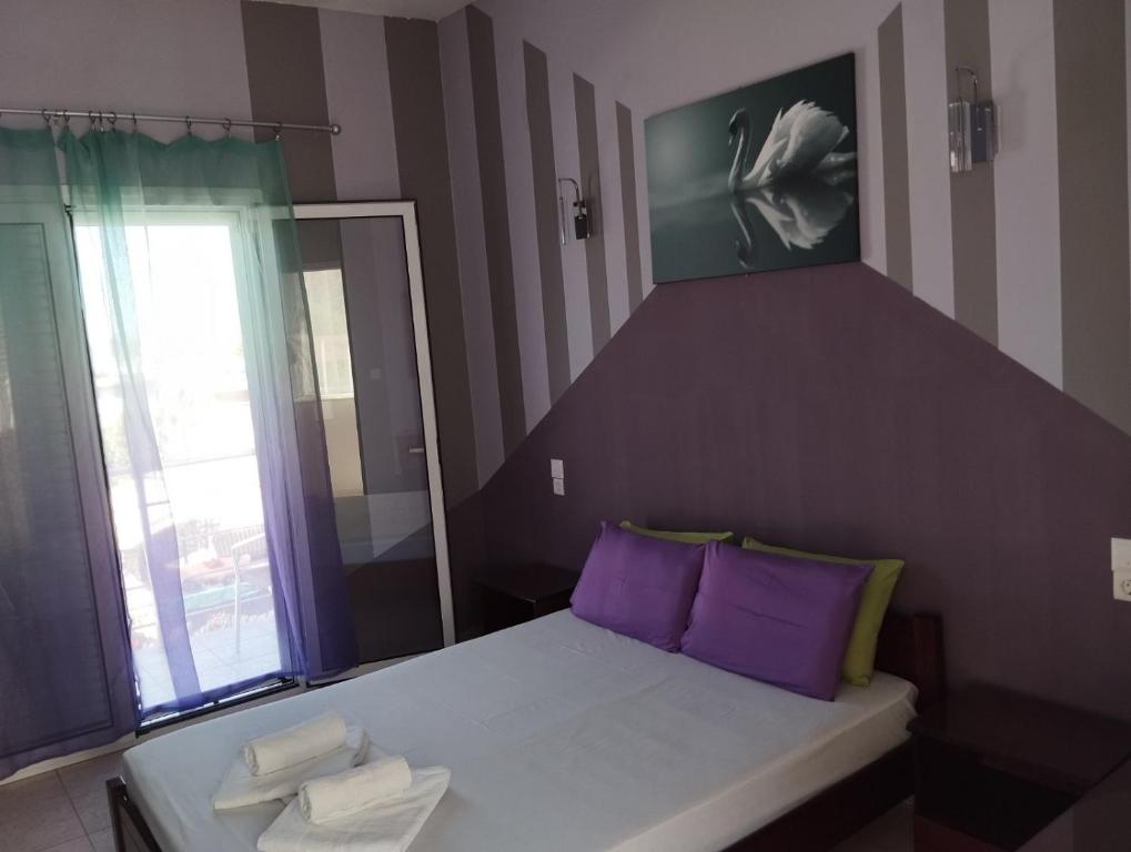 Postel nebo postele na pokoji v ubytování Hotel Neon Astron