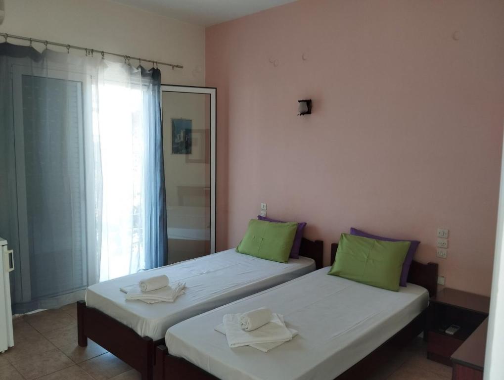 Postel nebo postele na pokoji v ubytování Hotel Neon Astron
