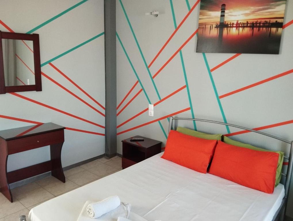 Postel nebo postele na pokoji v ubytování Hotel Neon Astron