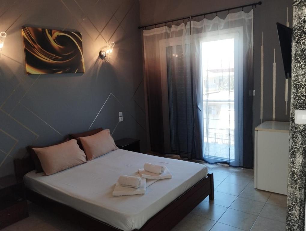 Postel nebo postele na pokoji v ubytování Hotel Neon Astron