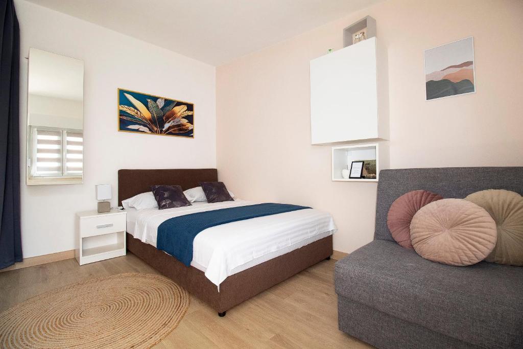 Postel nebo postele na pokoji v ubytování Studio Apartmani M