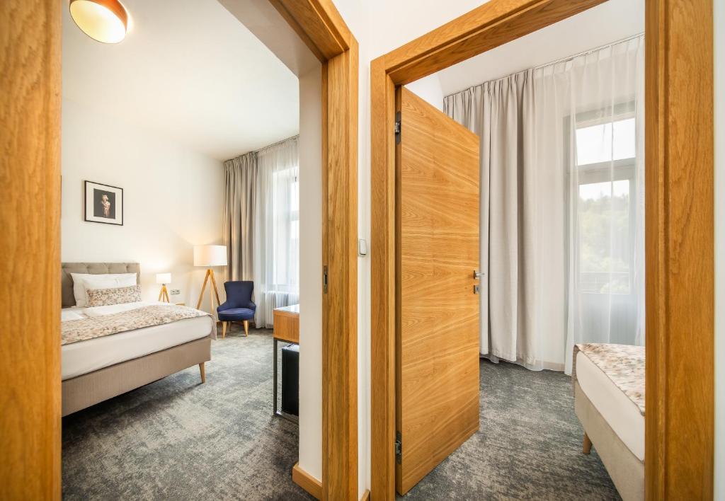 Postel nebo postele na pokoji v ubytování Residence Vyhlídka
