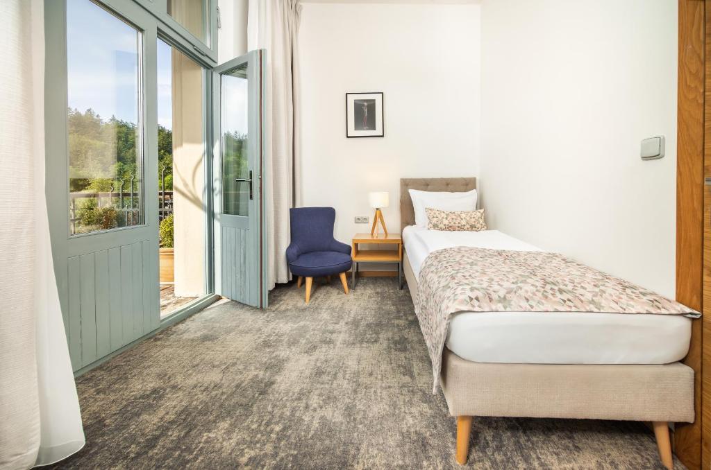 Postel nebo postele na pokoji v ubytování Residence Vyhlídka