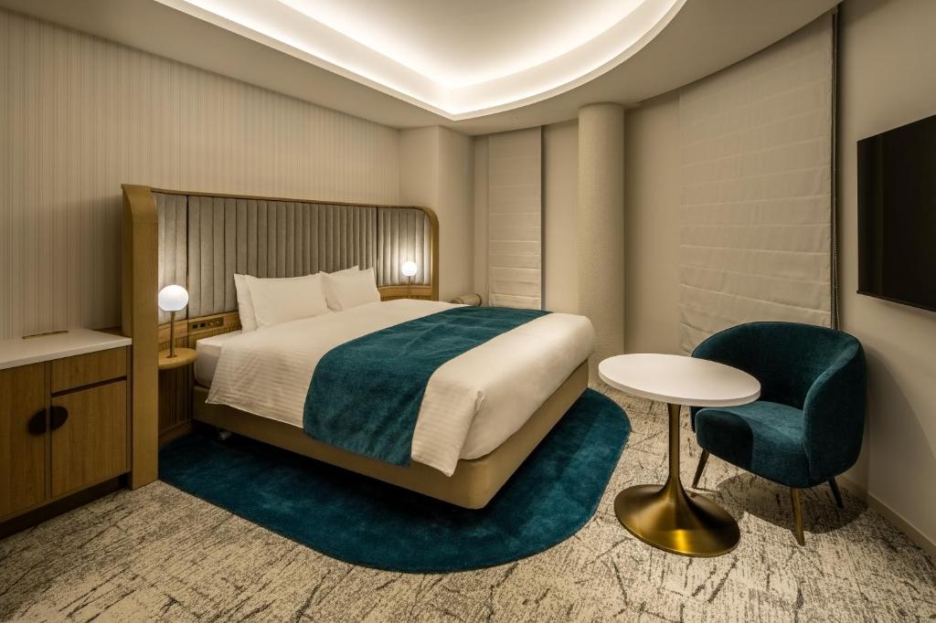Postel nebo postele na pokoji v ubytování Hotel Comento Yokohama Kannai