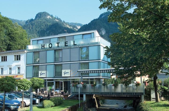 a hotel with a sign on the front of it at Businesshotel Valerian in Hohenems