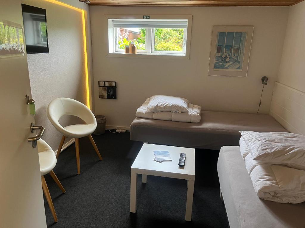 Postel nebo postele na pokoji v ubytování Skagentoppen Rooms