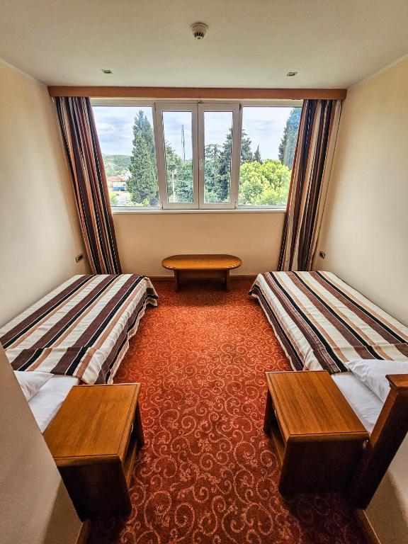 Postel nebo postele na pokoji v ubytování Mali Hotel BaMBiS