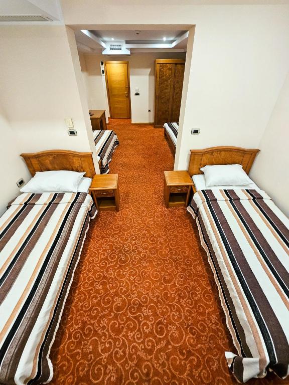 Postel nebo postele na pokoji v ubytování Mali Hotel BaMBiS