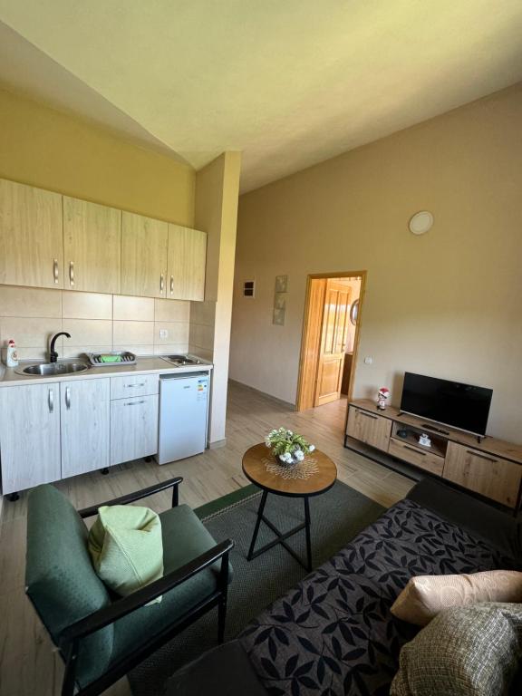 a living room with a couch and a table at Sunrise house apartments in Ulcinj