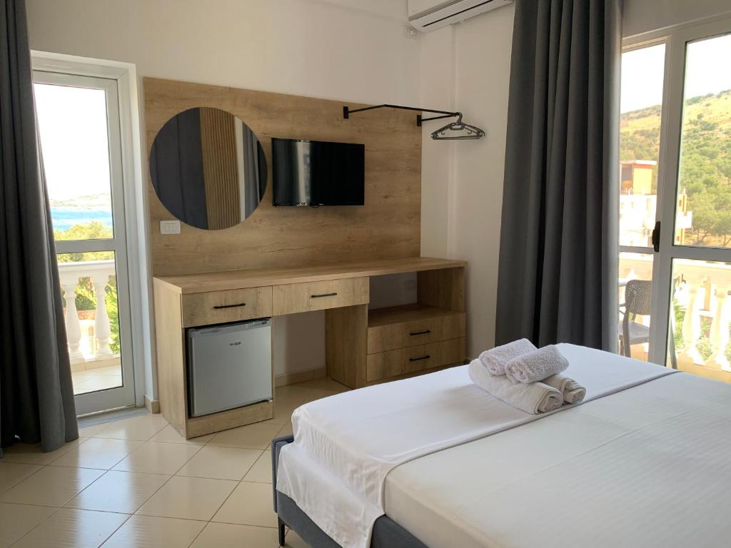 Postel nebo postele na pokoji v ubytování Hotel Villa Ambra