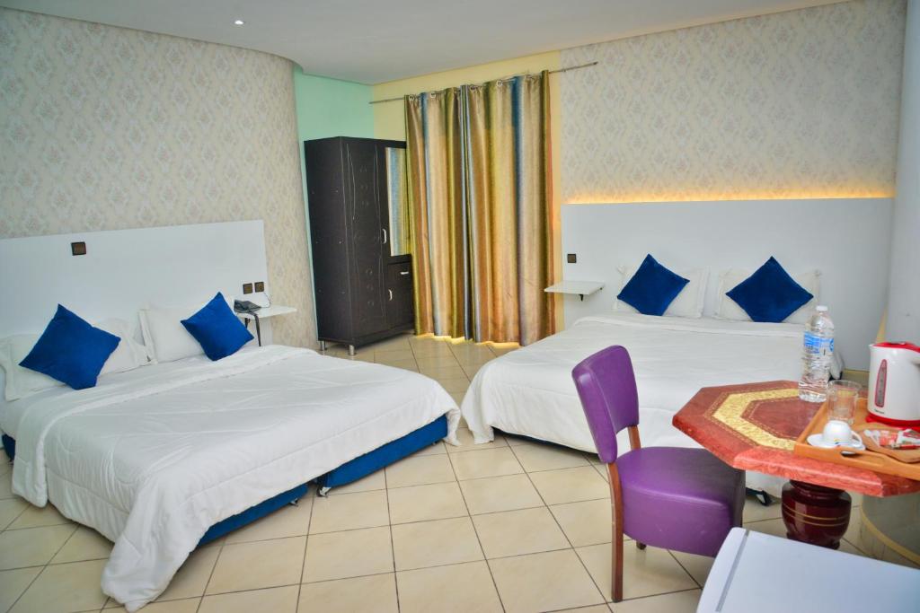 Postel nebo postele na pokoji v ubytování Free Zone Hotel