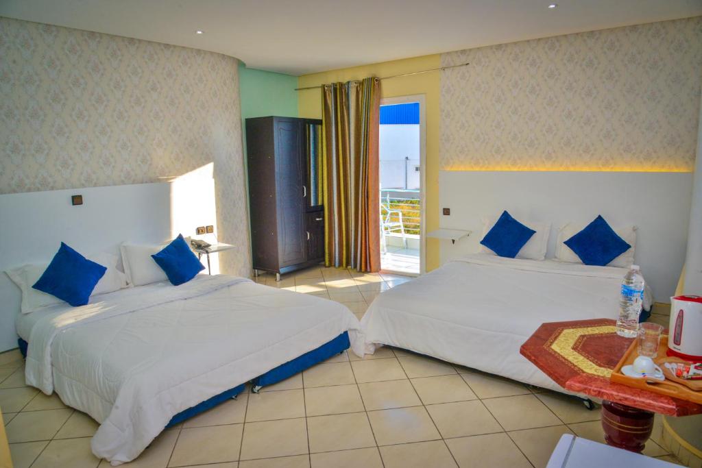 Postel nebo postele na pokoji v ubytování Free Zone Hotel