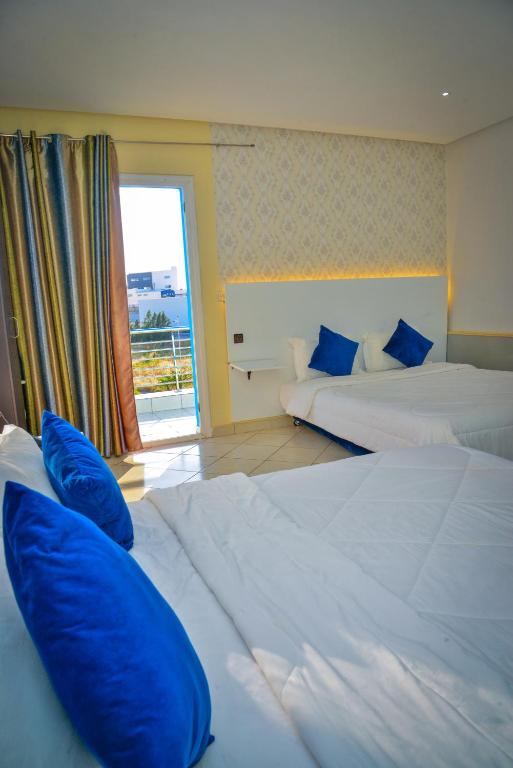 Postel nebo postele na pokoji v ubytování Free Zone Hotel