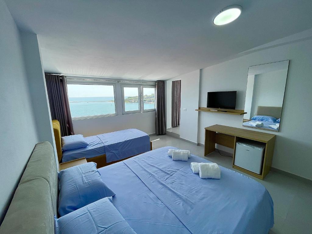 Postel nebo postele na pokoji v ubytování Kloi Luxe Appart-Hotel
