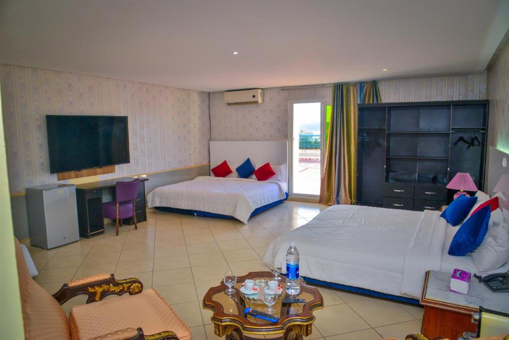 Postel nebo postele na pokoji v ubytování Free Zone Hotel