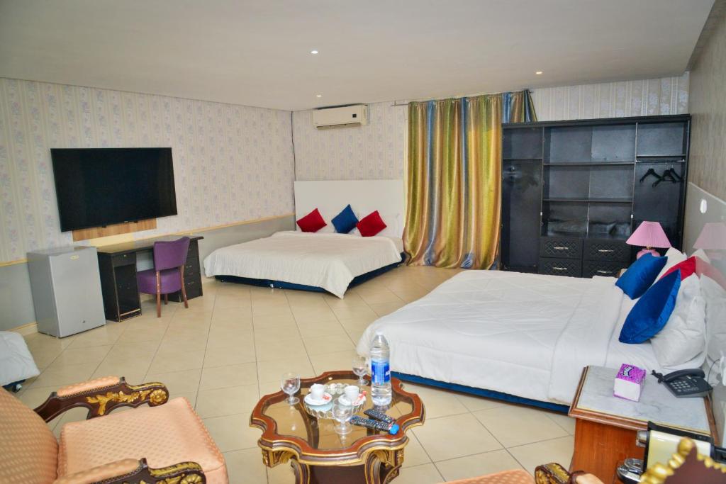 Postel nebo postele na pokoji v ubytování Free Zone Hotel