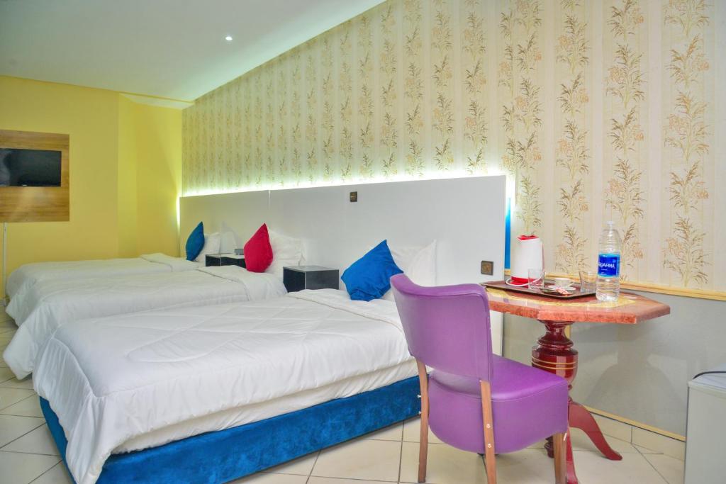 Postel nebo postele na pokoji v ubytování Free Zone Hotel