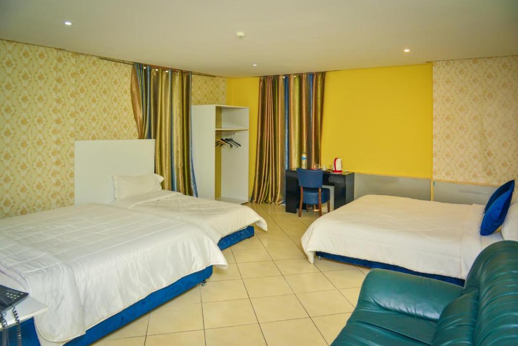 Postel nebo postele na pokoji v ubytování Free Zone Hotel