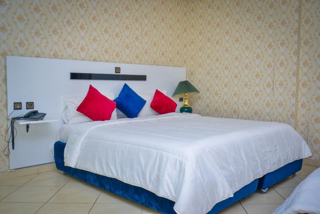 Postel nebo postele na pokoji v ubytování Free Zone Hotel