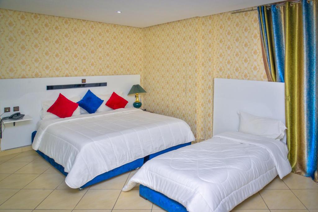 Postel nebo postele na pokoji v ubytování Free Zone Hotel