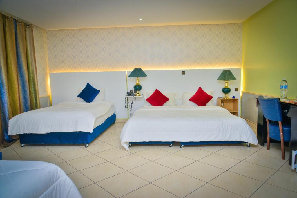 Postel nebo postele na pokoji v ubytování Free Zone Hotel