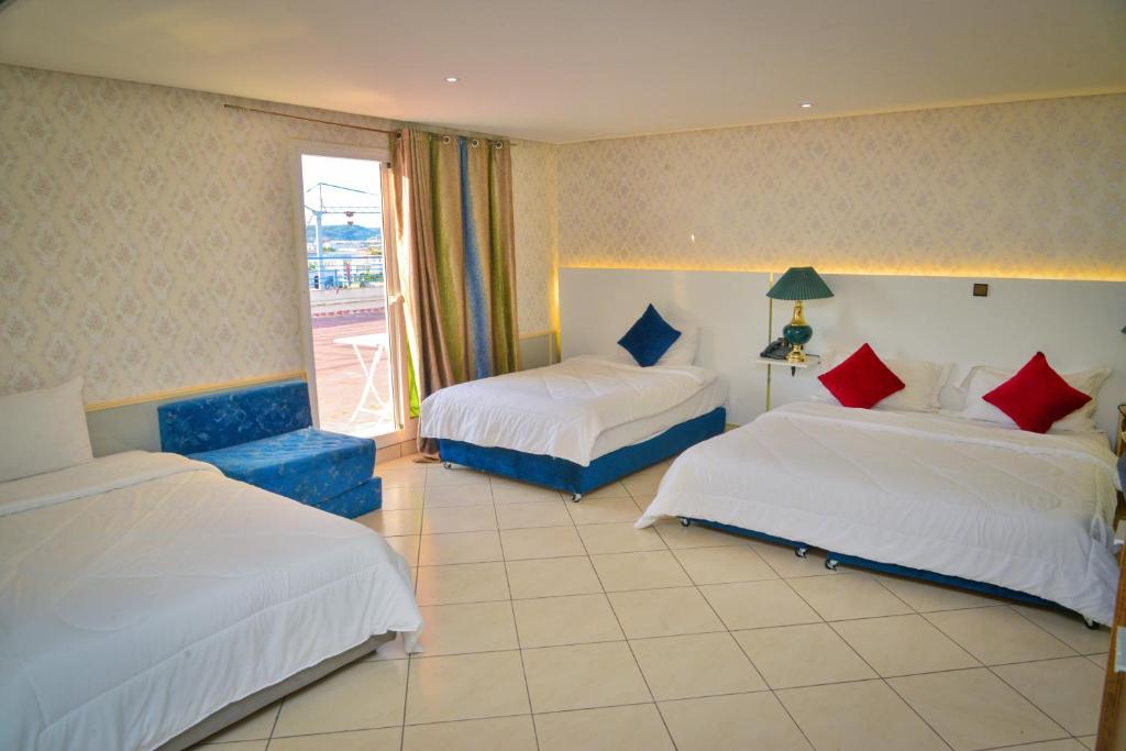 Postel nebo postele na pokoji v ubytování Free Zone Hotel
