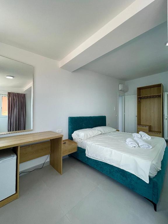 Postel nebo postele na pokoji v ubytování Kloi Luxe Appart-Hotel
