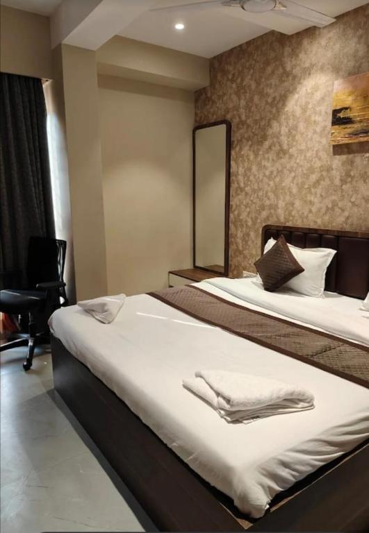 Postel nebo postele na pokoji v ubytování Urban Cliff Hotel