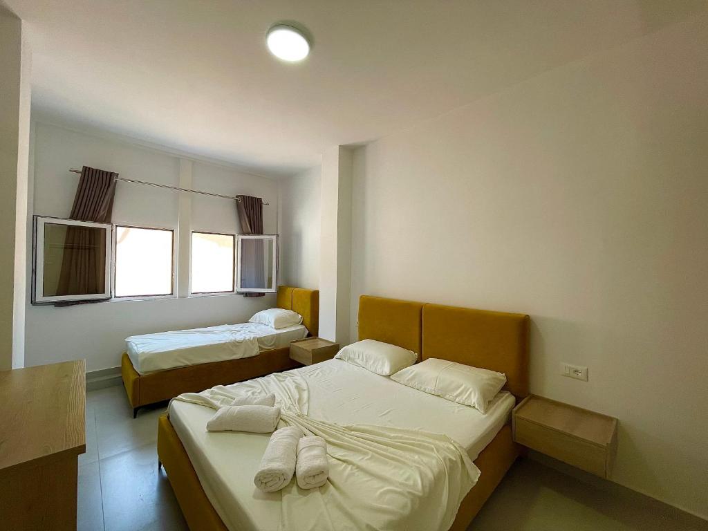 Postel nebo postele na pokoji v ubytování Kloi Luxe Appart-Hotel