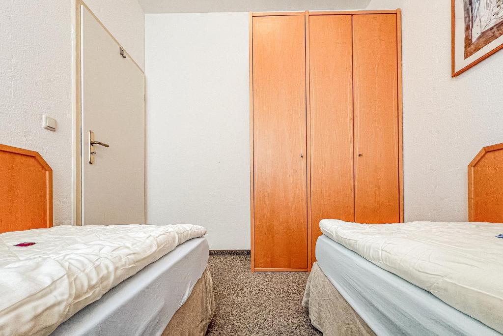 Postel nebo postele na pokoji v ubytování Villa Viktoria Whg 4 - "Kapitänskoje"