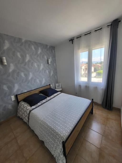 Postel nebo postele na pokoji v ubytování Maison chaleureuse