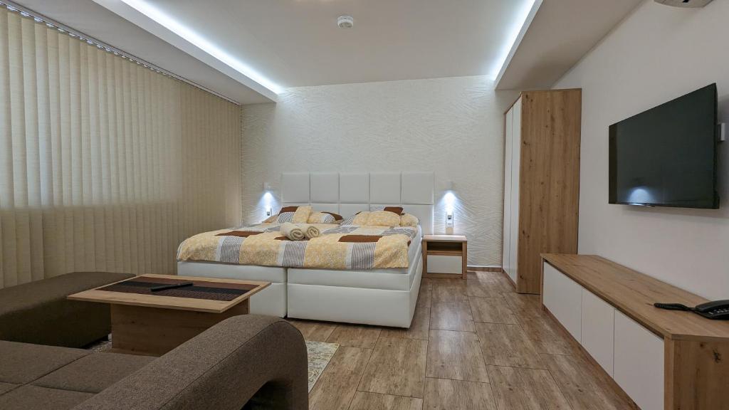 Łóżko lub łóżka w pokoju w obiekcie Apartmán Štěpánka