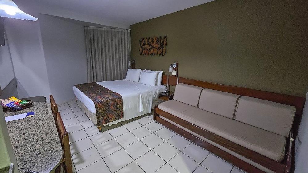 Cama ou camas em um quarto em Littoral Hotel