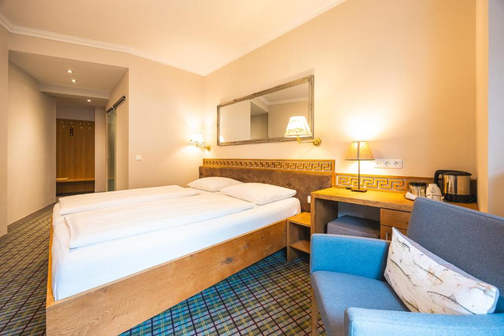 Voodi või voodid majutusasutuse Fish'Inn Zell - Hotel Fischerwirt toas