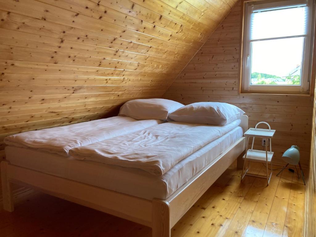 Postel nebo postele na pokoji v ubytování Domki Ptasie Radio