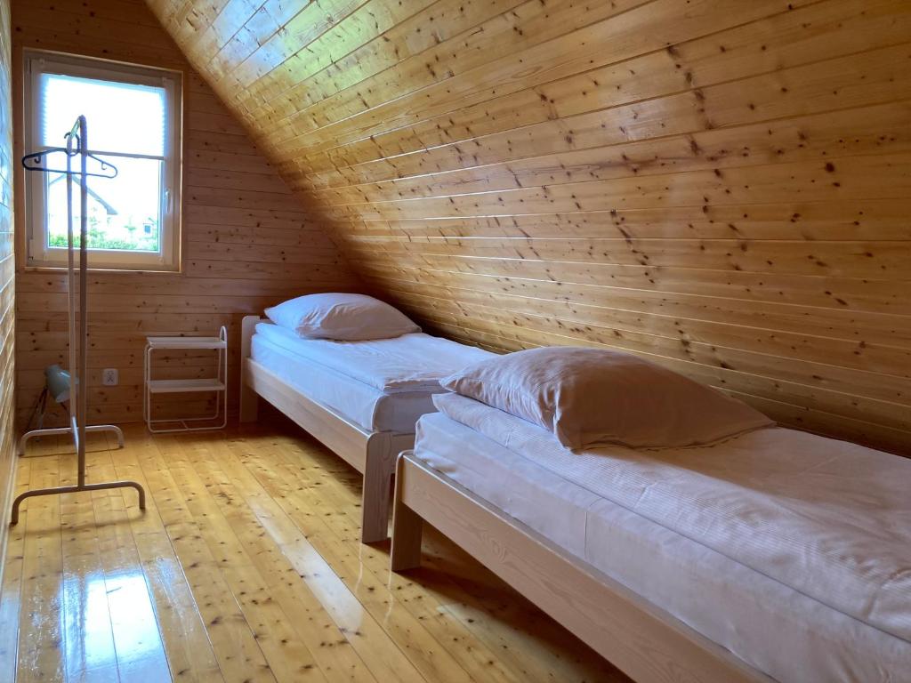 Postel nebo postele na pokoji v ubytování Domki Ptasie Radio