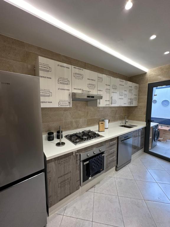 Kuchyň nebo kuchyňský kout v ubytování Appartement view sea martil only family