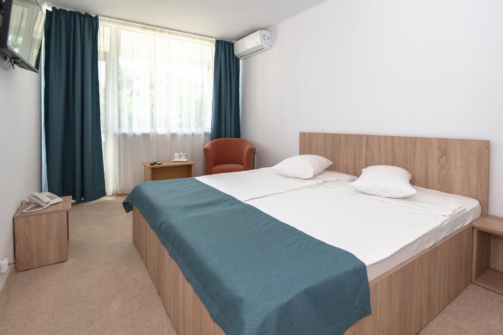 Postel nebo postele na pokoji v ubytování Hotel Semiramis