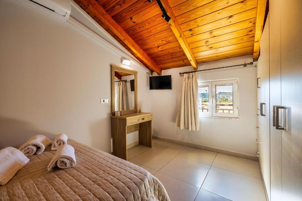Postel nebo postele na pokoji v ubytování Ionian Serenity House