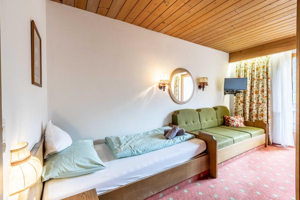 Postel nebo postele na pokoji v ubytování keyone rooms Gerlos