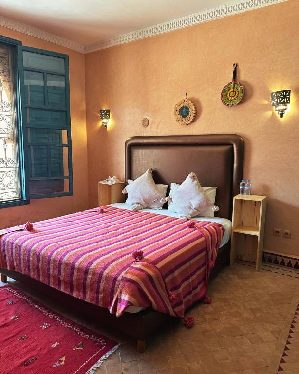 Postel nebo postele na pokoji v ubytování Palais Riad Berbère